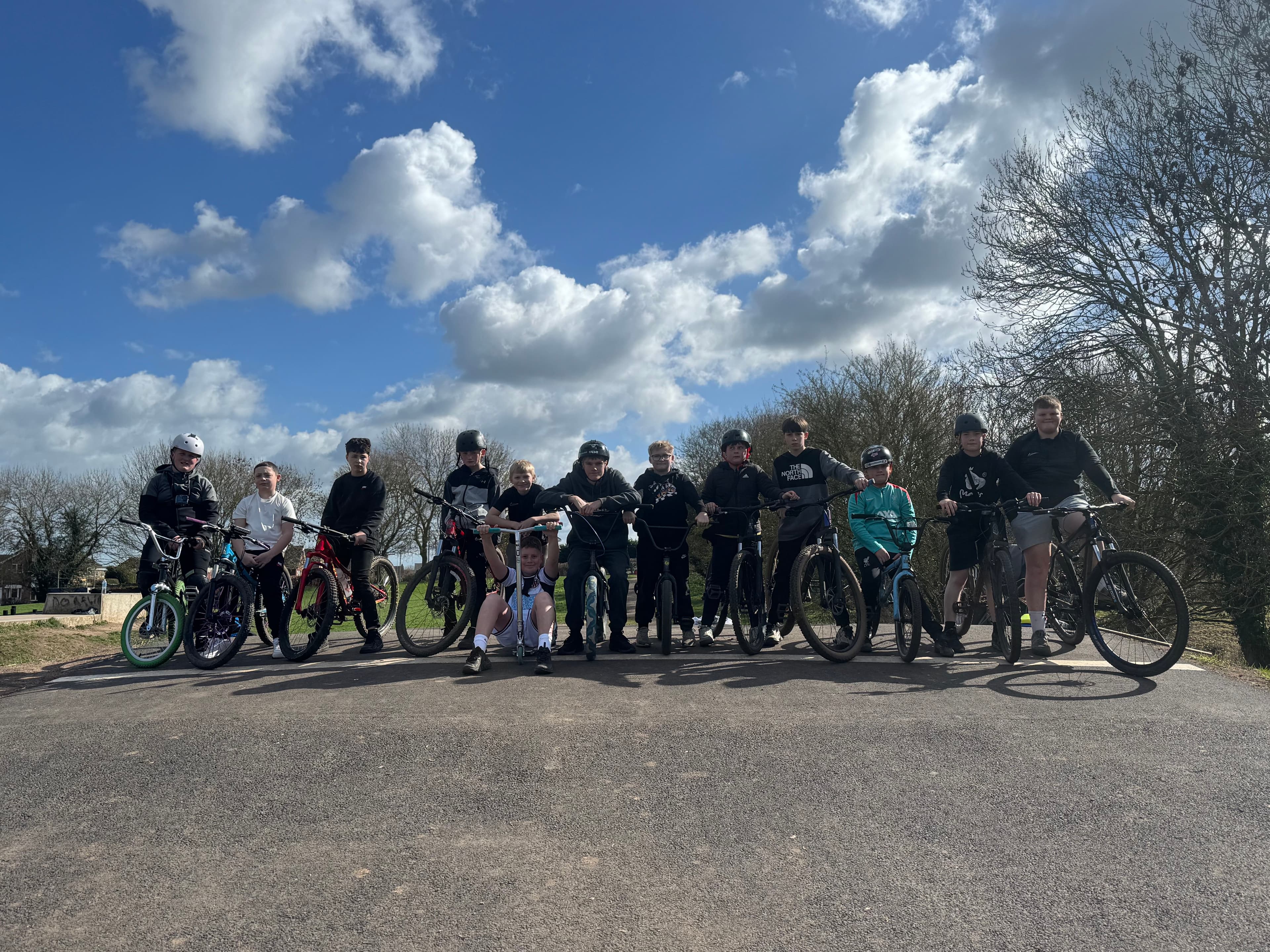 Coach talking riders through a pump track line